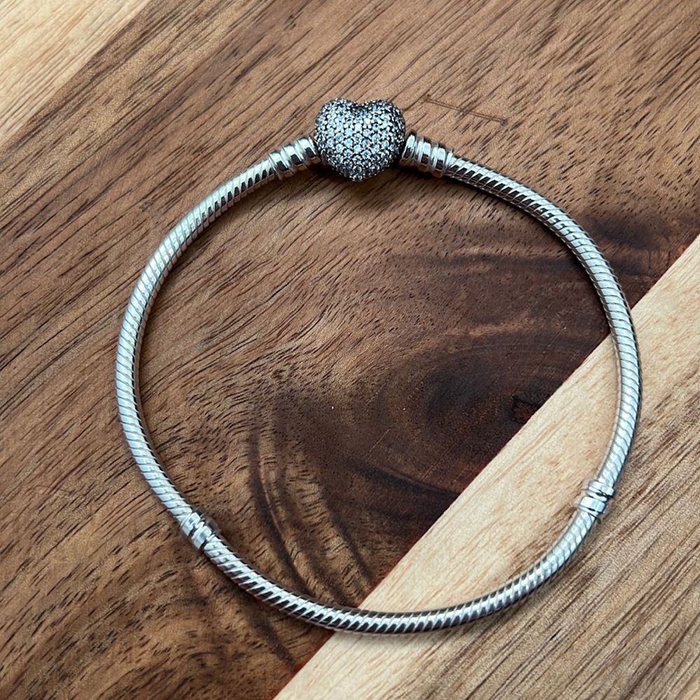 Pandora!!! This bracelet has the classic heart clasp but with a paved flare.